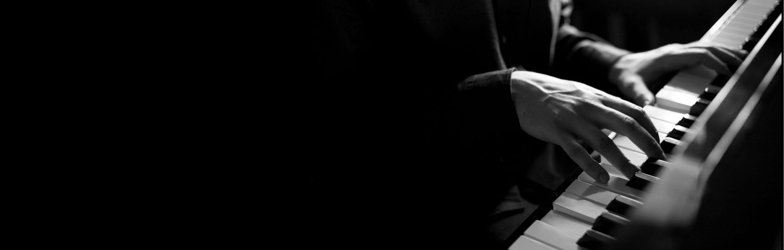 close up of gentleman playing the piano