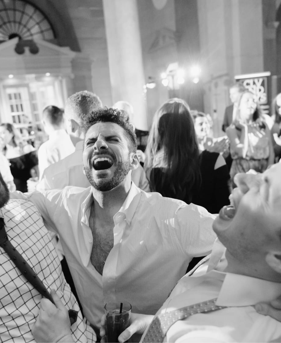 close-up of a group of gentleman singing and dancing