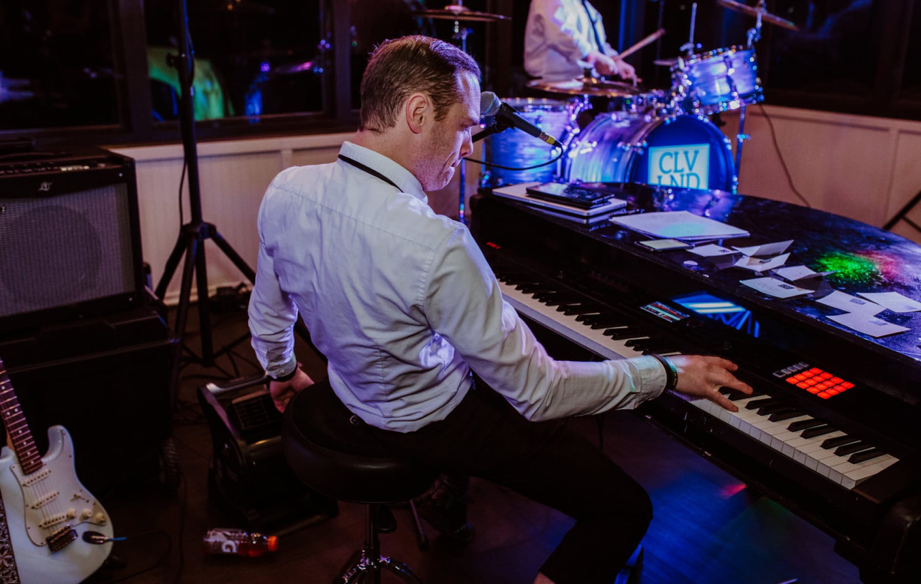 close-up of Gregg Coffey playing the piano
