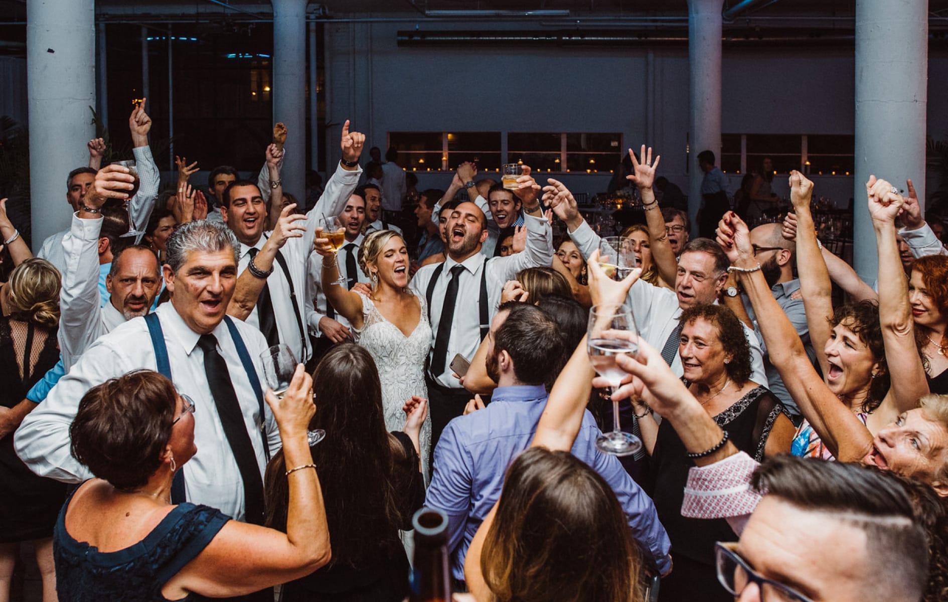 group of people raising their glasses