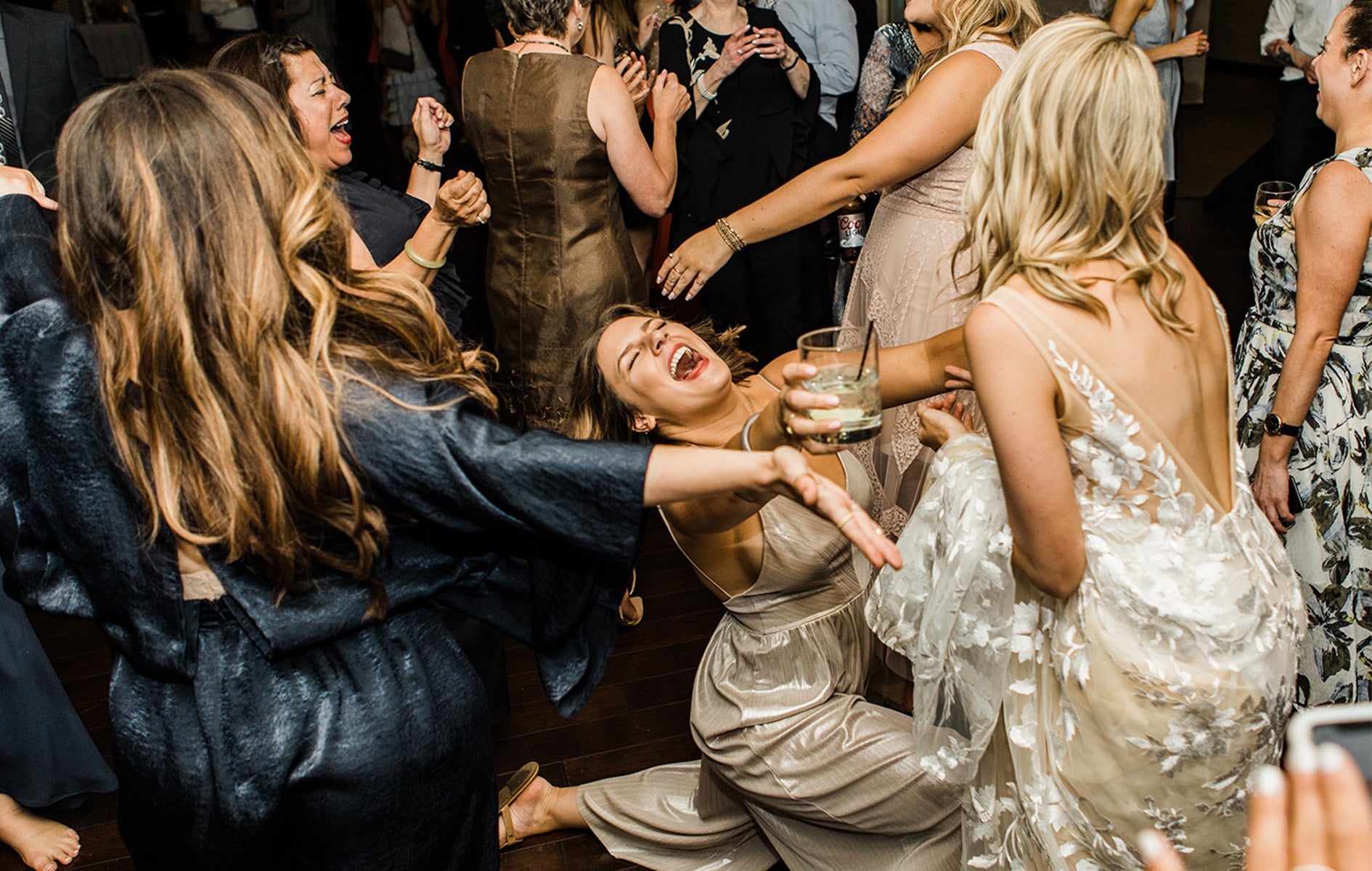 bride and her friend dancing on the dance floor